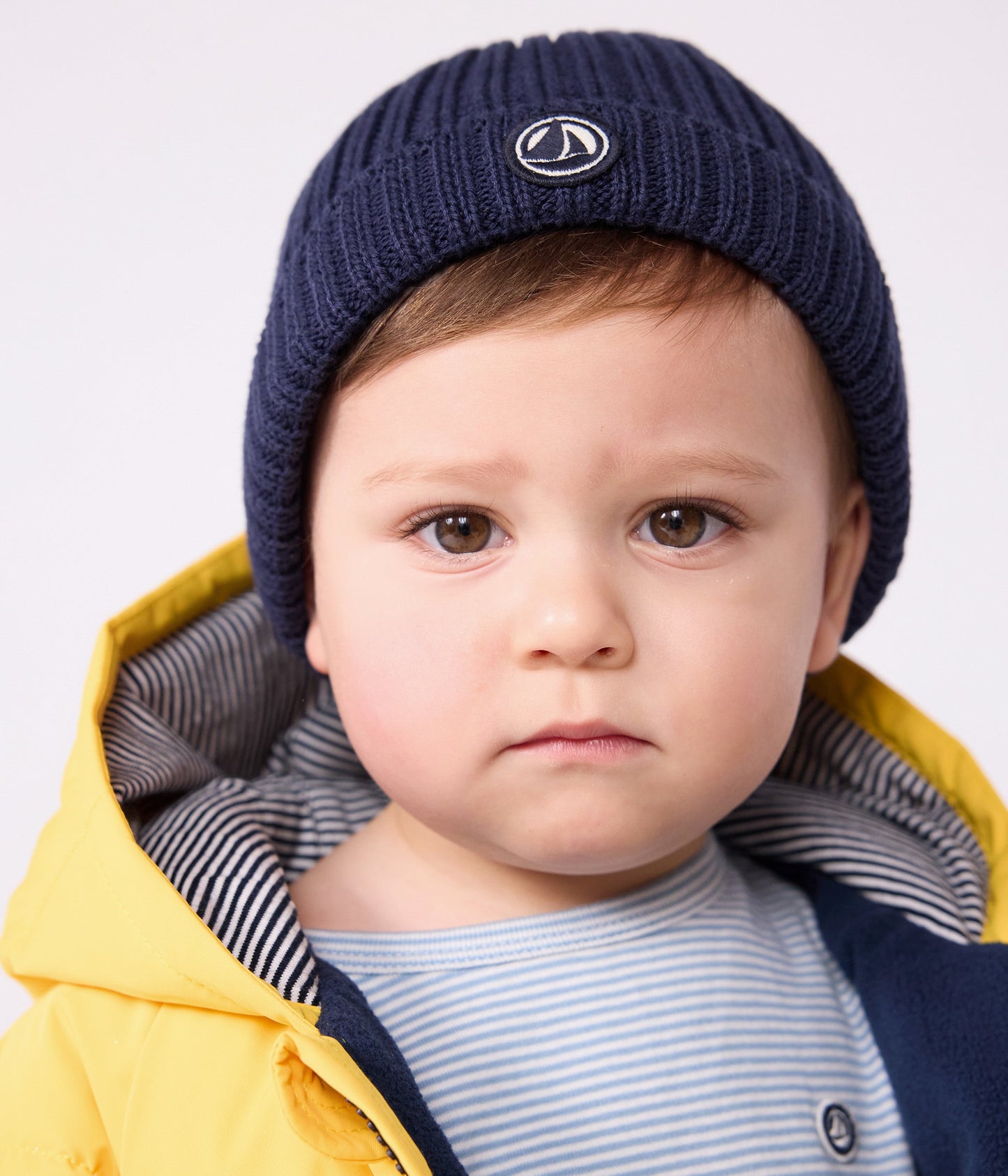 Bonnet bébé en tricot doublé en polaire