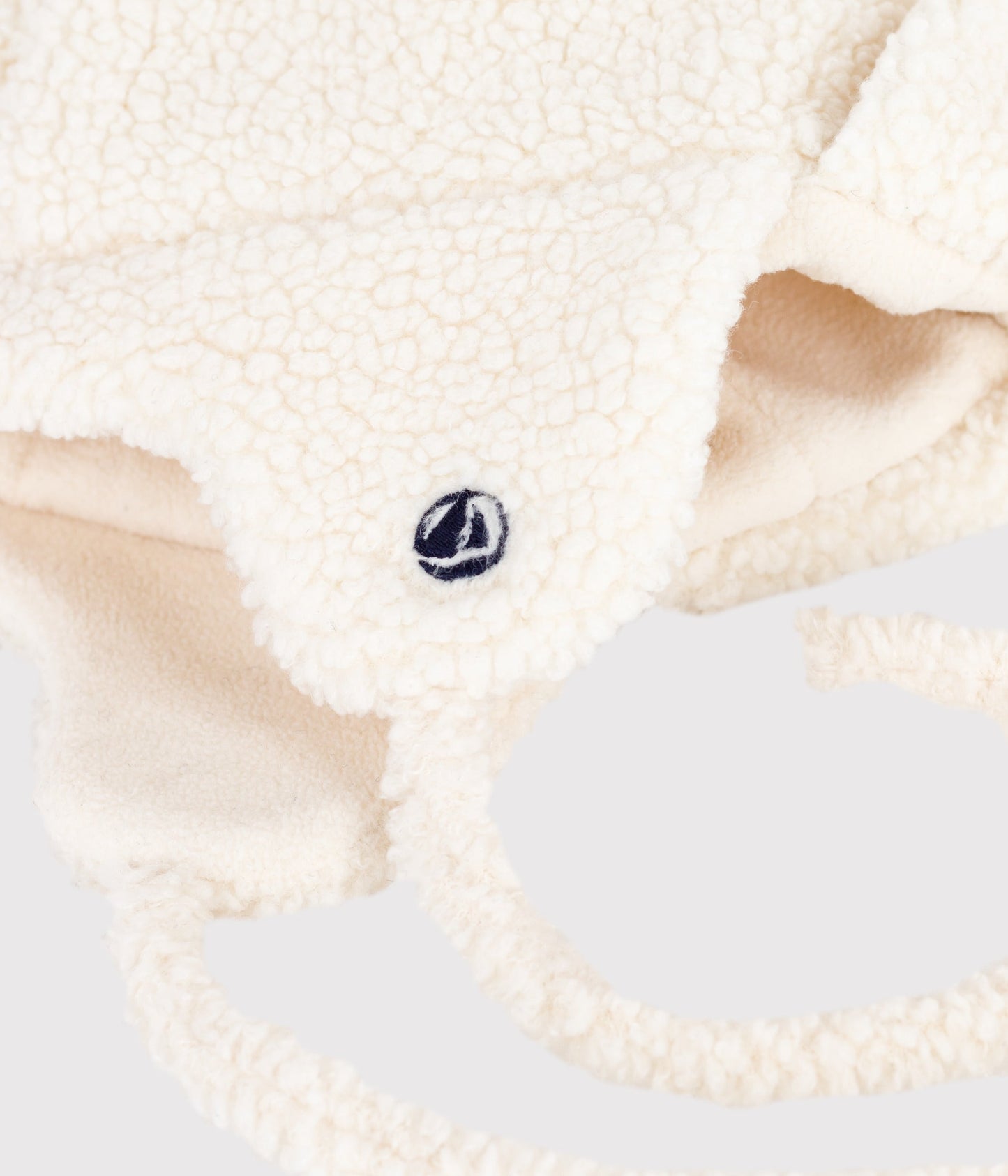 Chapka bébé en fausse fourrure doublée sherpa