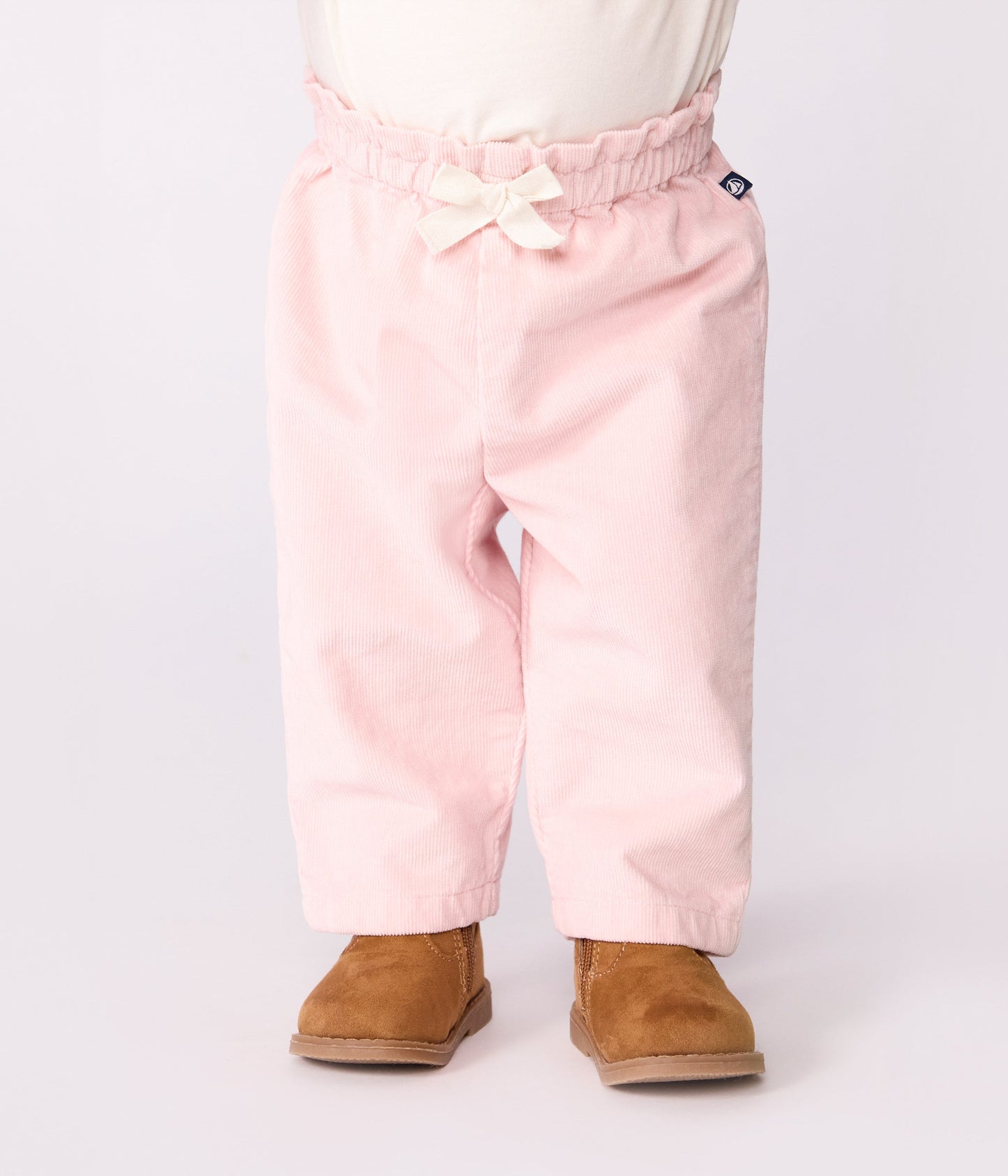Pantalon bébé en velours uni et poche arrière brodée