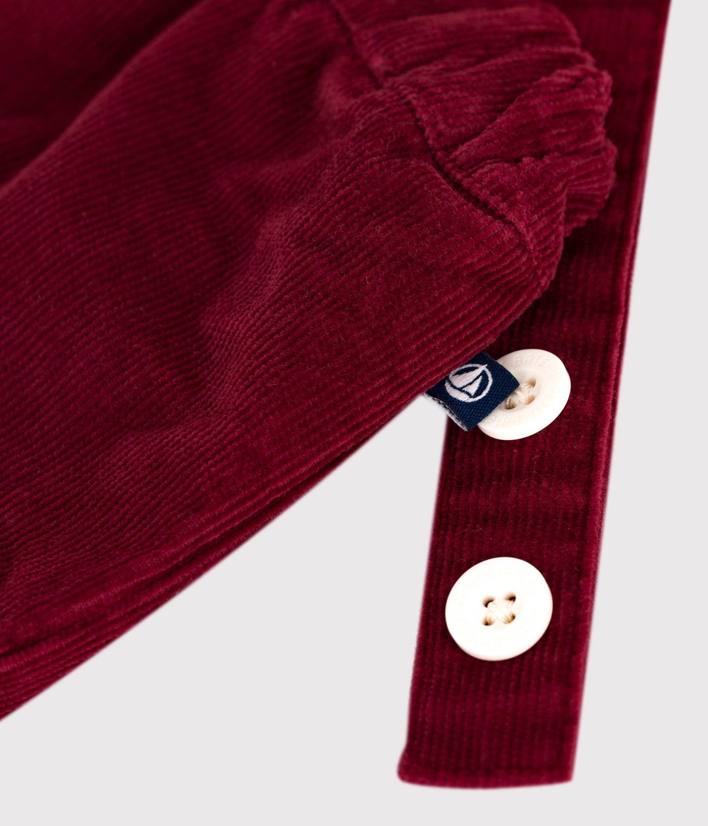 Short à bretelles bébé en velours uni