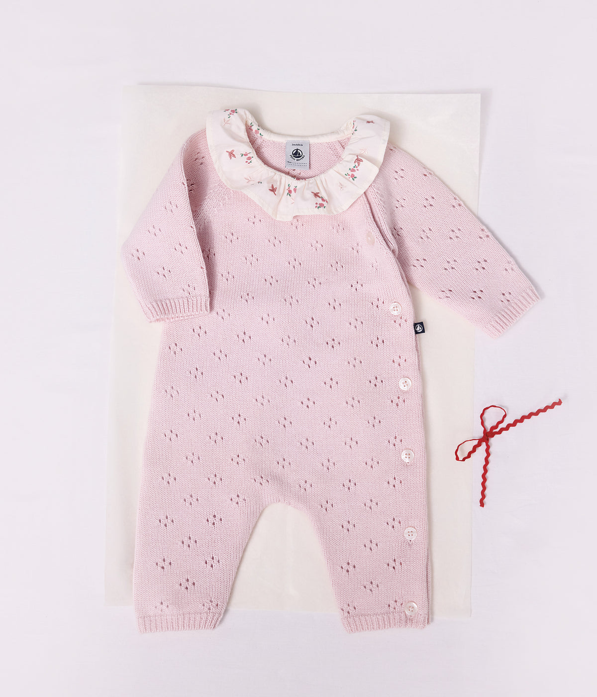 combinaison bebe en tricot laine et coton a col uni